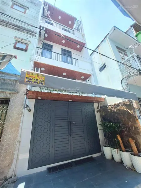 Nhà 3 lầu hẻm xe hơi phan văn trị, dt 4m x 12m, sát mặt tiền giá 7,3 tỷ