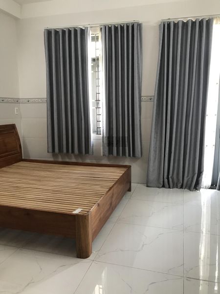 Cho thuê nhà nguyên căn trệt hai lầu sân thượng đường xe hơi phường phú thuận quận 7